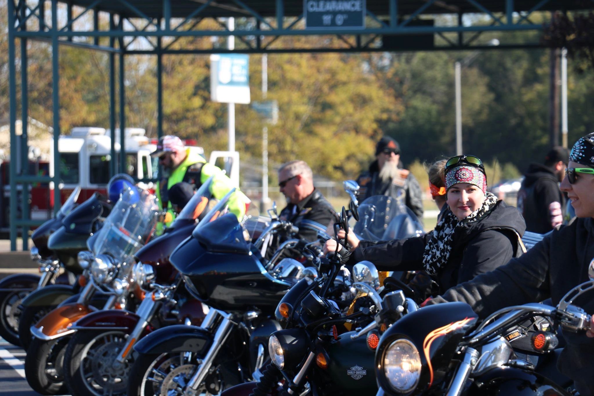 Motorcycle rally with cruiser bikes lined up at outdoor event